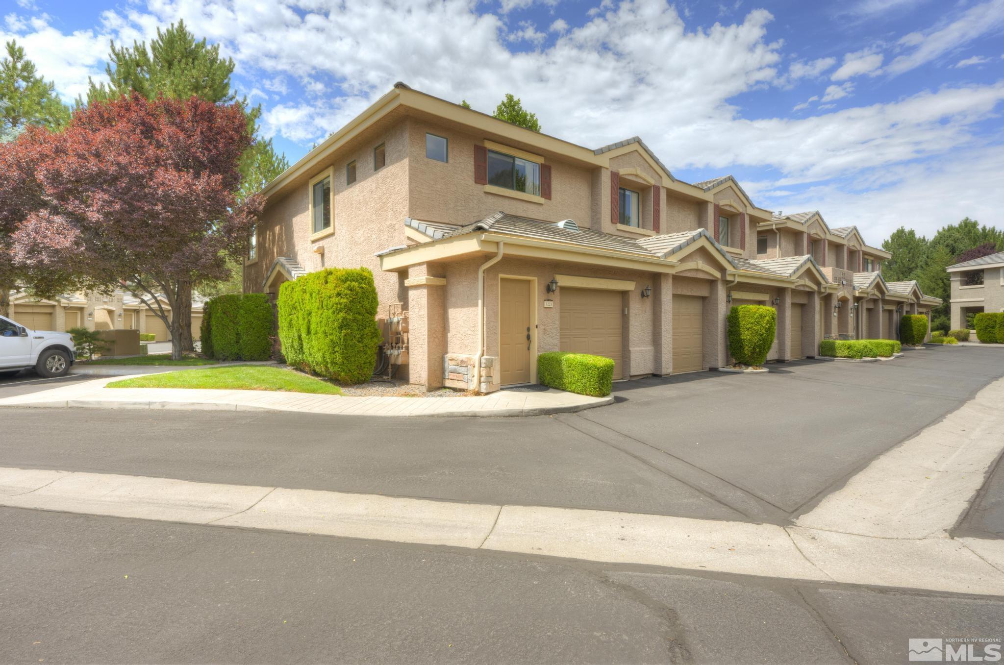 900 South, Unit 5221 Reno, NV 89521 - Photo 3 of 39 a front view of a house with a garden and pathway