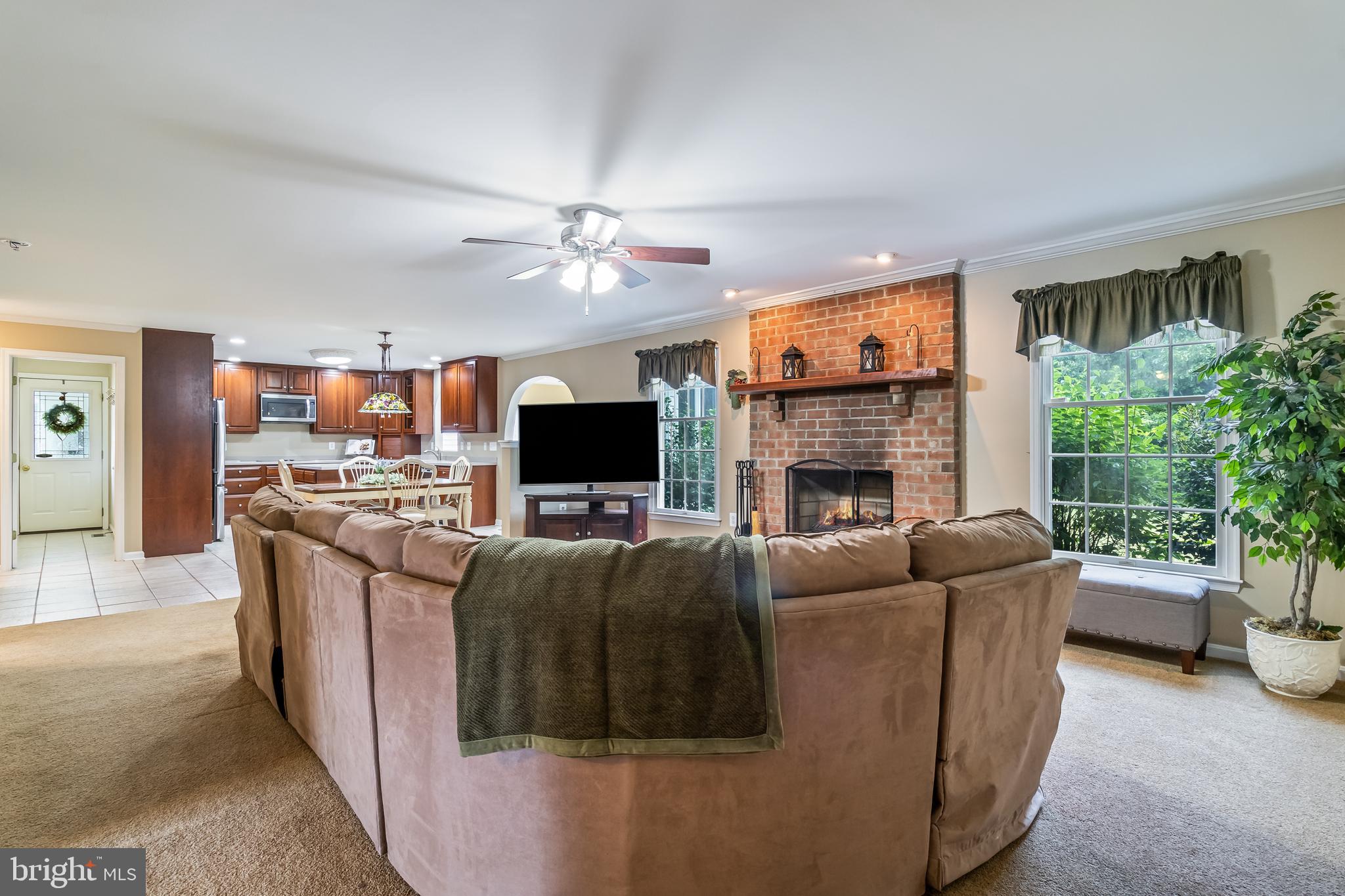 203 Morgans Ridge Court La Plata, MD 20646 - Photo 25 of 59 a living room with furniture a flat screen tv and a fireplace