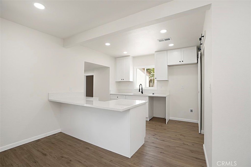 6056 Colonial Drive Riverside, CA 92506 - Photo 11 of 30 a kitchen with a sink stainless steel appliances and cabinets