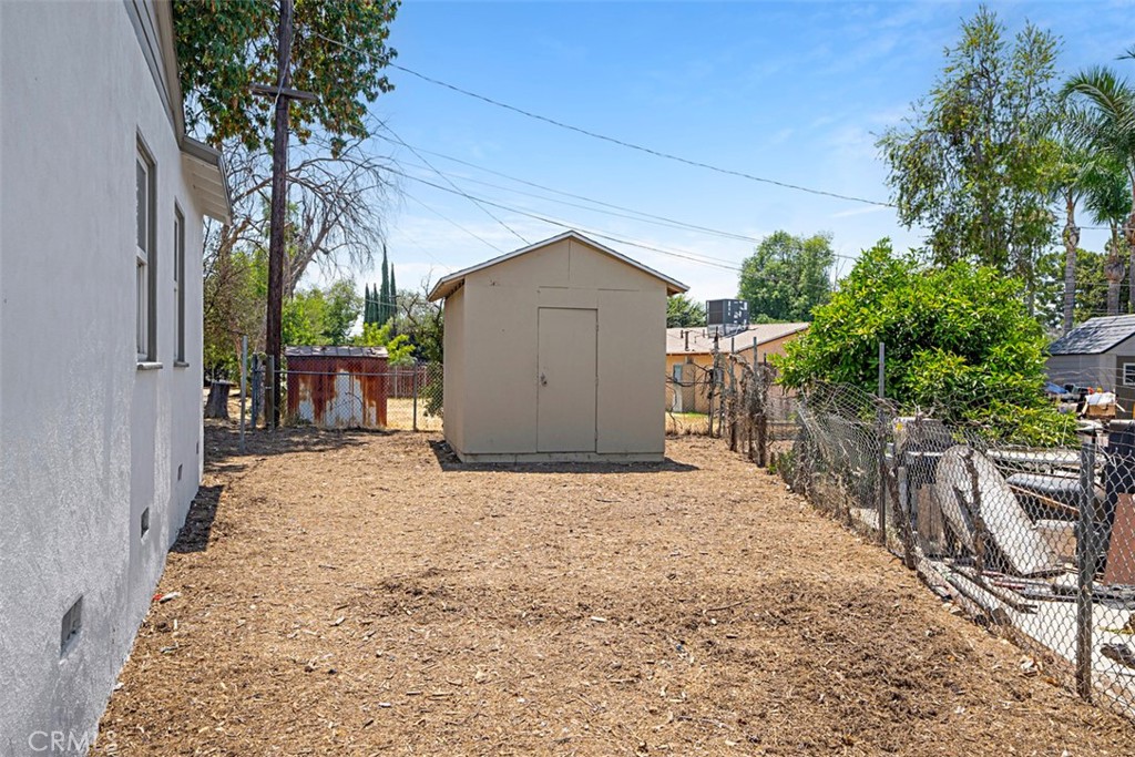 6056 Colonial Drive Riverside, CA 92506 - Photo 26 of 30 a backyard of a house with plants and trees