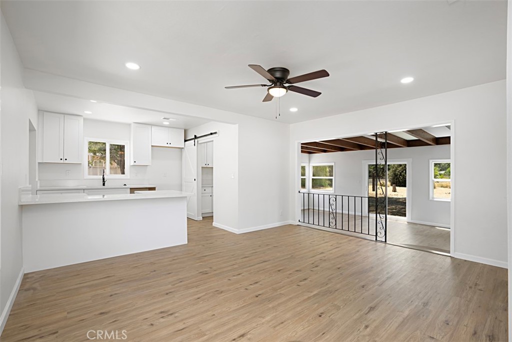 6056 Colonial Drive Riverside, CA 92506 - Photo 8 of 30 a view of a kitchen with a sink and wooden floor