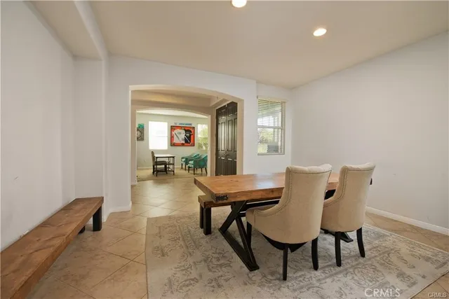 a view of a room with furniture and wooden floor
