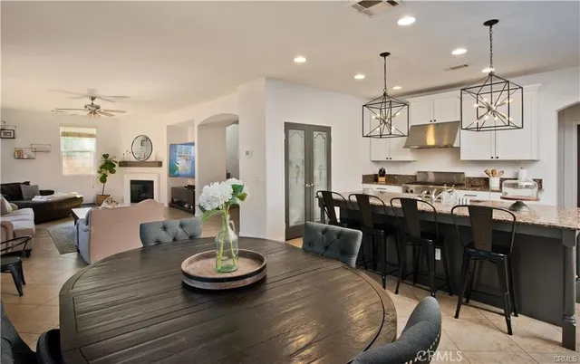 a large kitchen with a table and chairs