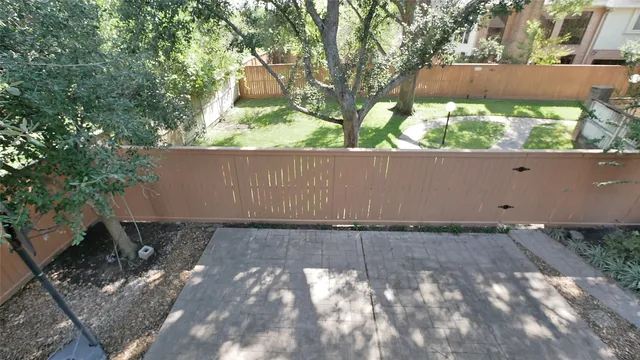 a view of a kitchen with a refrigerator and a sink