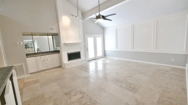 a kitchen with a sink stove and cabinets