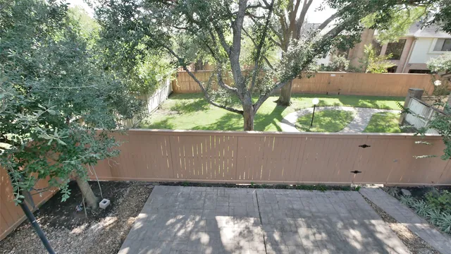 a view of a house with backyard porch and sitting area