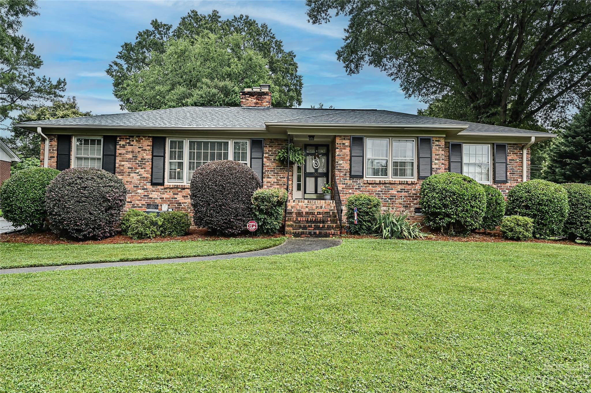 5511 Valley Forge Road Charlotte, NC 28210 - Photo 1 of 22 a front view of a house with garden