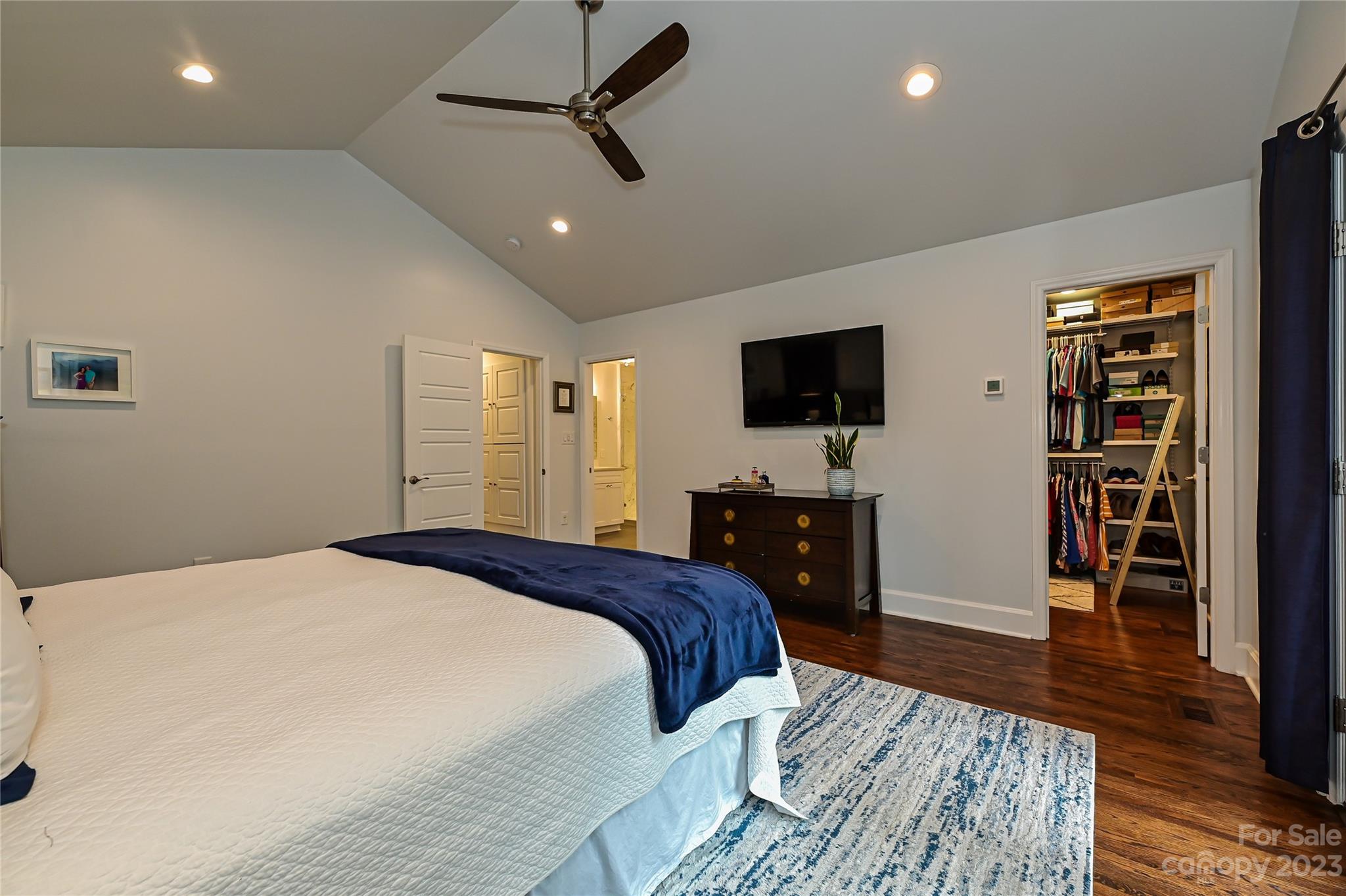 5511 Valley Forge Road Charlotte, NC 28210 - Photo 11 of 22 a spacious bedroom with a bed and a flat screen tv