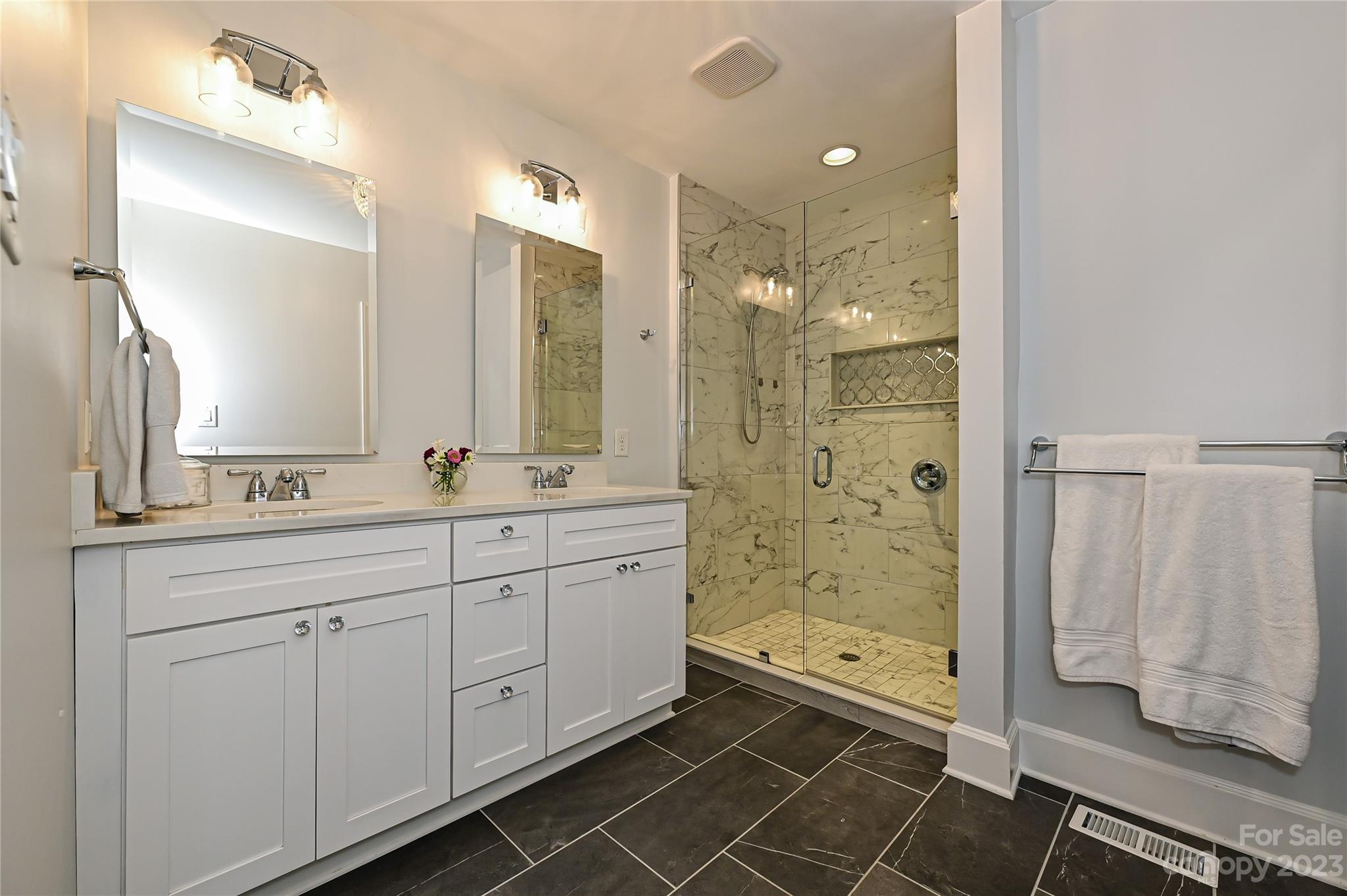 5511 Valley Forge Road Charlotte, NC 28210 - Photo 12 of 22 a bathroom with a double vanity sink toilet and shower