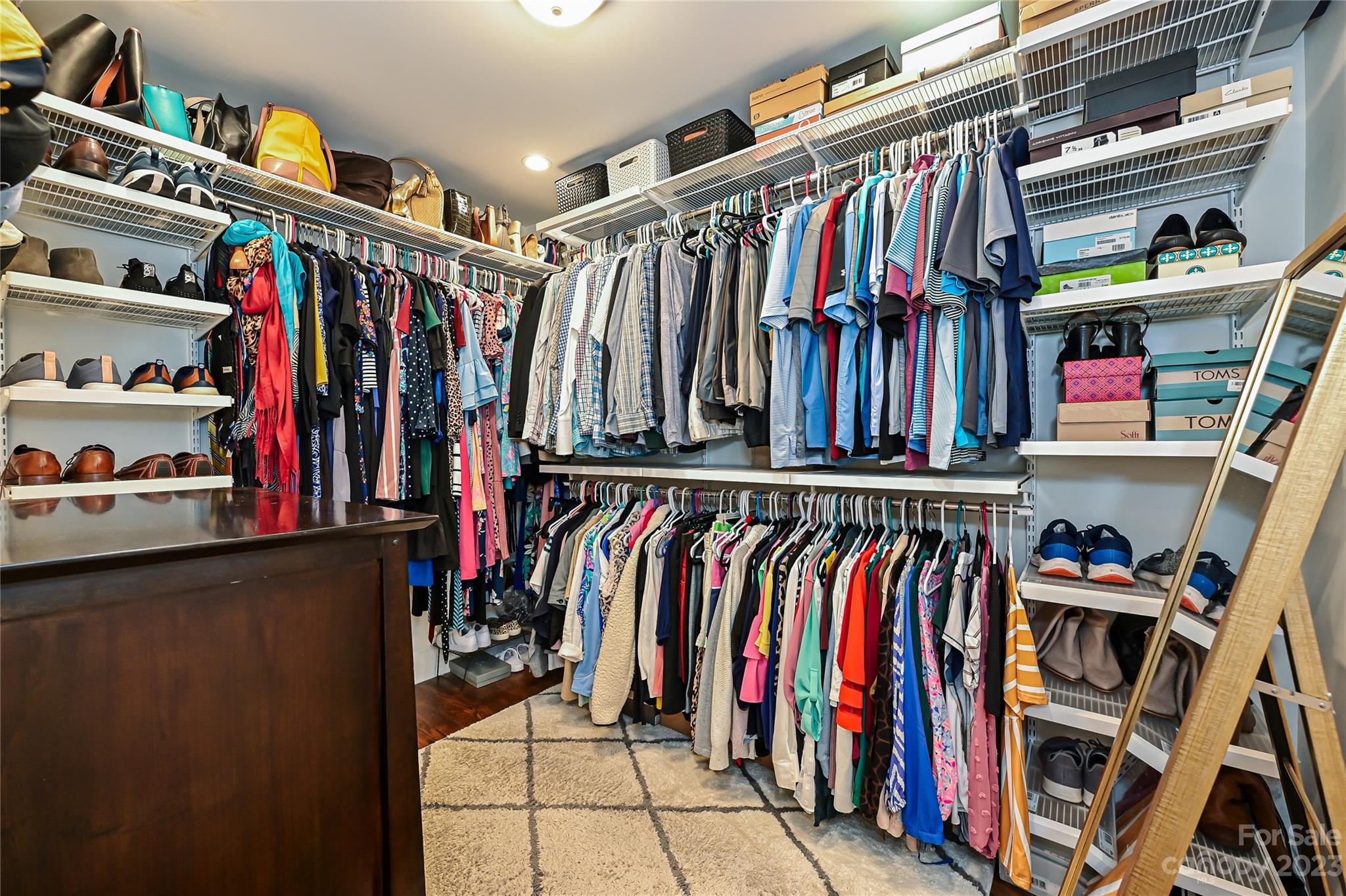 5511 Valley Forge Road Charlotte, NC 28210 - Photo 13 of 22 a view of walk in closet with clothes and shoes