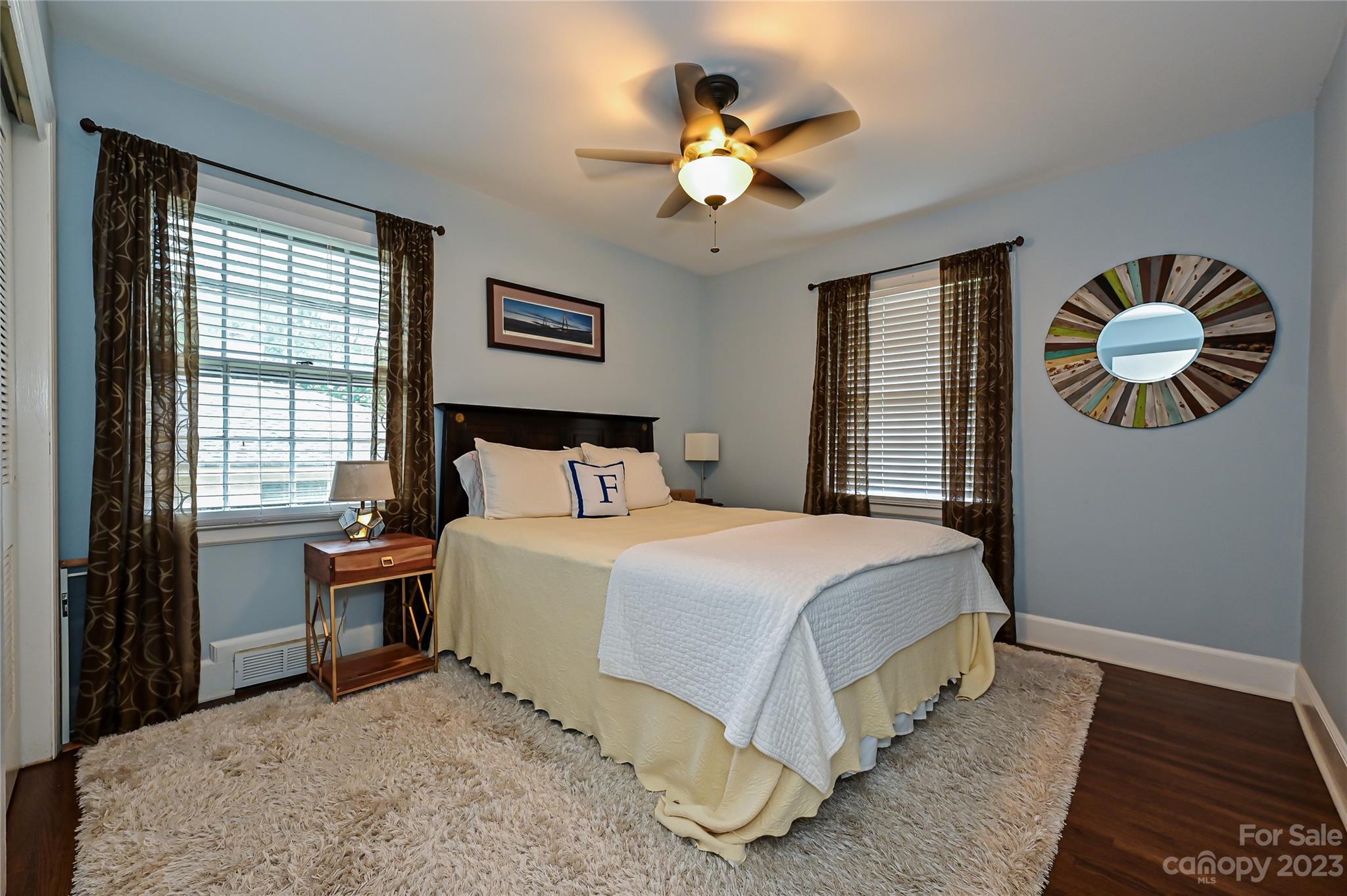 5511 Valley Forge Road Charlotte, NC 28210 - Photo 15 of 22 a bedroom with a bed and a chandelier