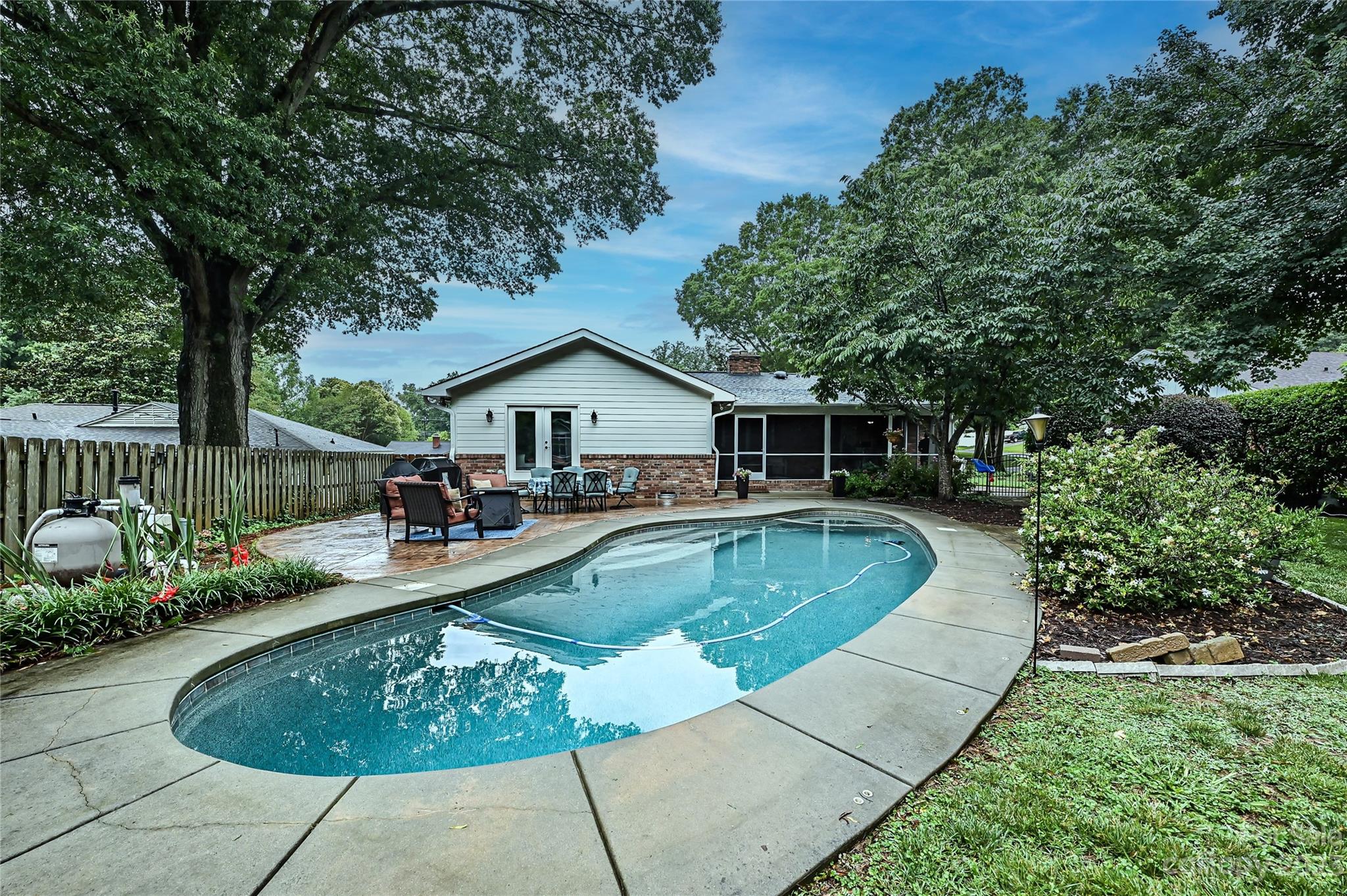 5511 Valley Forge Road Charlotte, NC 28210 - Photo 20 of 22 a view of a house with swimming pool and furniture