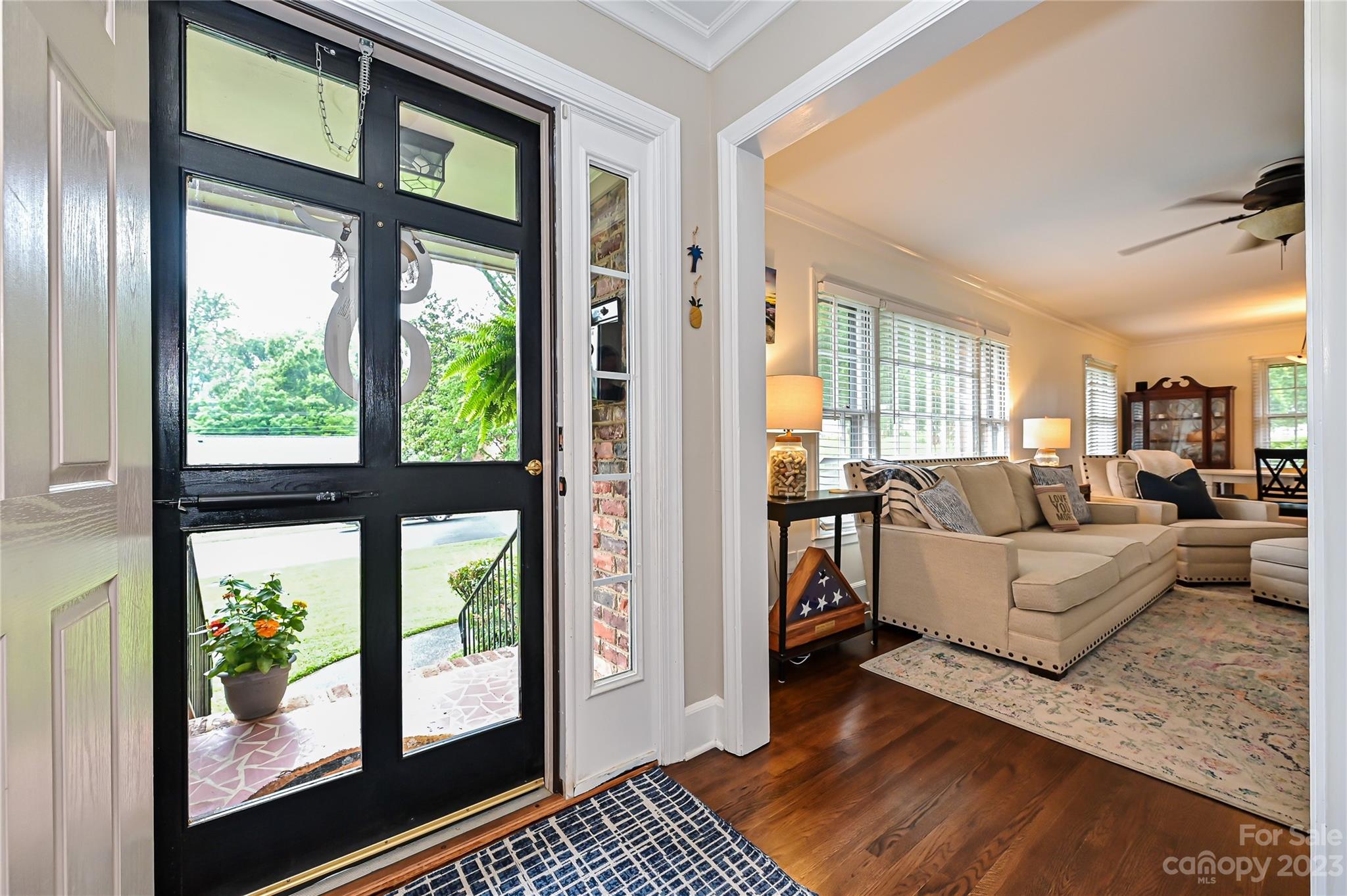 5511 Valley Forge Road Charlotte, NC 28210 - Photo 3 of 22 a living room with furniture and a floor to ceiling window