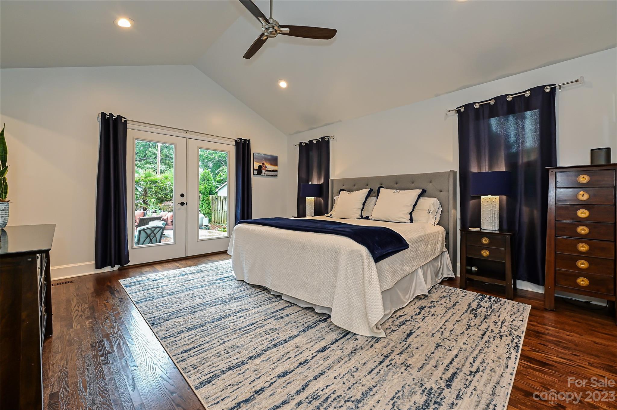 5511 Valley Forge Road Charlotte, NC 28210 - Photo 10 of 22 a bedroom with a bed lamp closet and large window