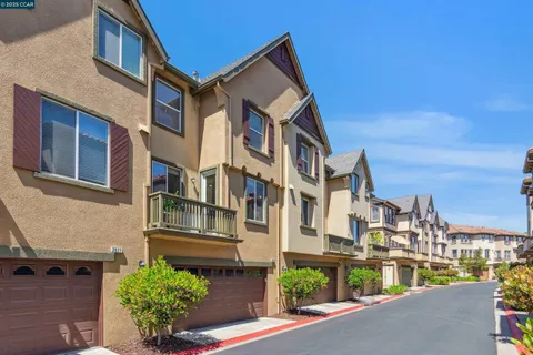 a view of a backyard with a patio and plants