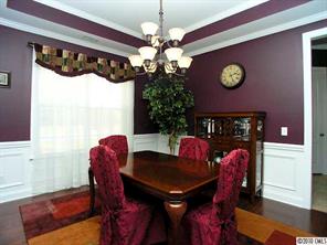1139 Gold Rush Court Fort Mill, SC 29708 - Photo 3 of 16 a view of a dining room with furniture and chandelier