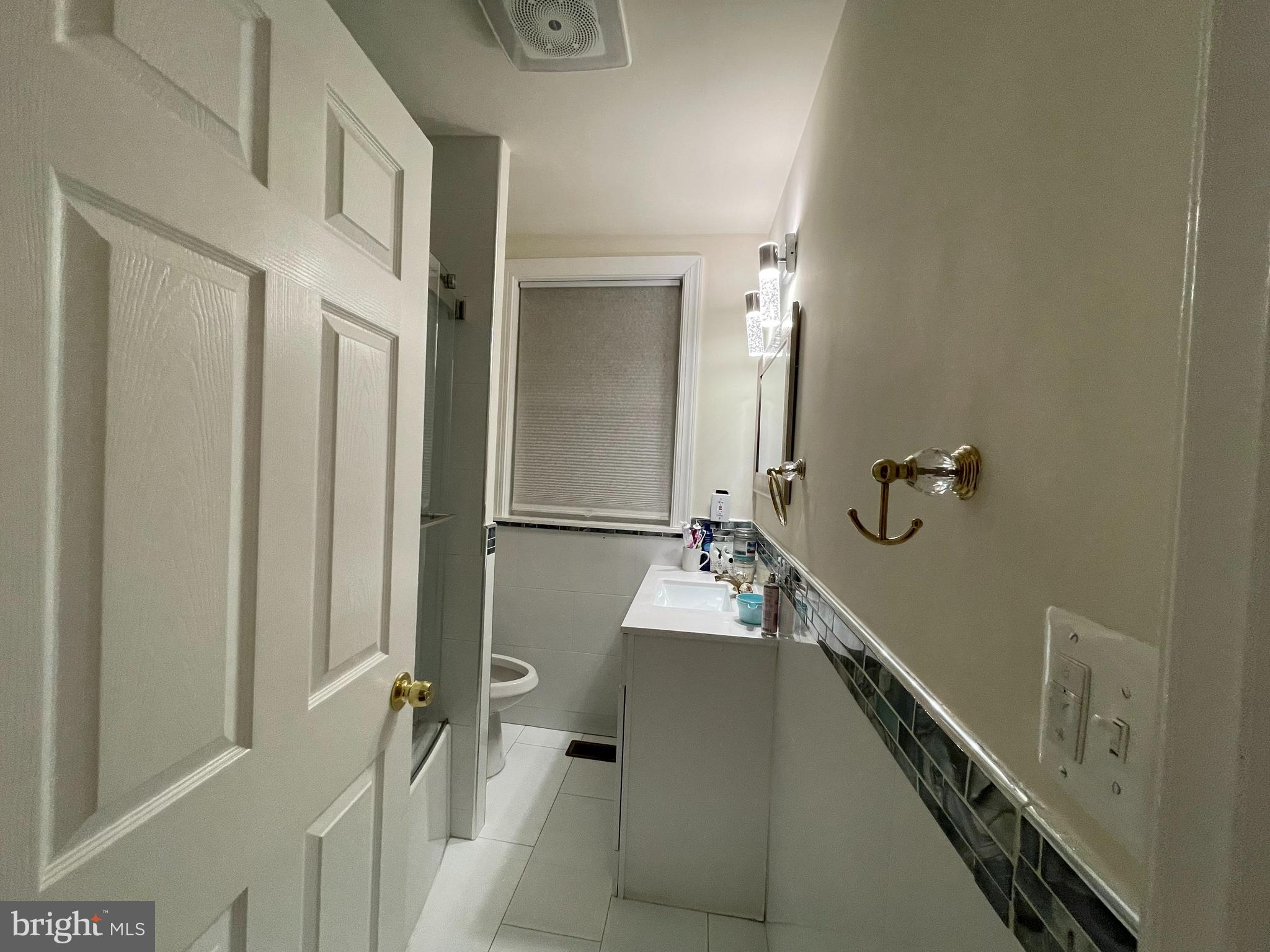 147 Lexington Avenue Lansdowne, PA 19050 - Photo 22 of 32 a bathroom with a sink a mirror and shower