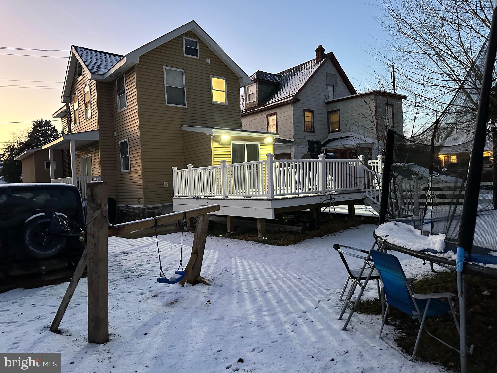147 Lexington Avenue Lansdowne, PA 19050 - Photo 6 of 32 a front view of a house with a chairs and table in a patio