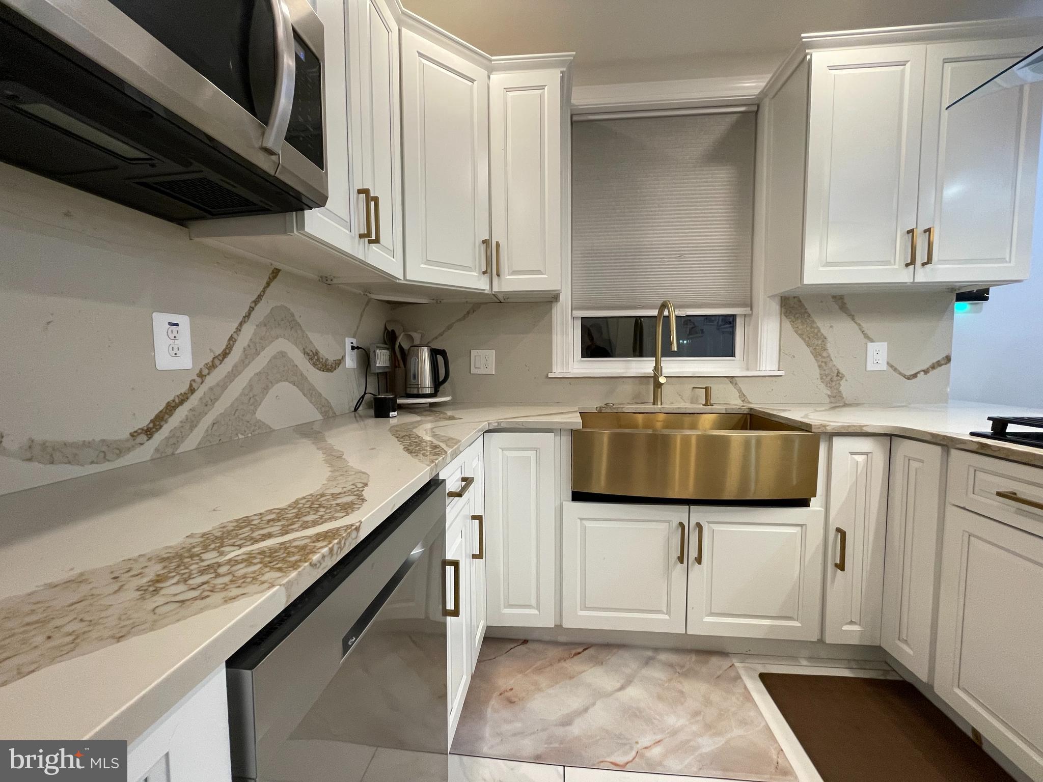 147 Lexington Avenue Lansdowne, PA 19050 - Photo 9 of 32 a kitchen with a sink and cabinets