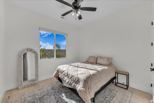 404 North Marsala Way St. George, UT 84770 - Photo 17 of 26 Bedroom featuring light wood-style flooring and a ceiling fan