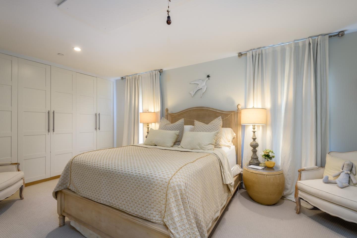 215 Mirada Road Half Moon Bay, CA 94019 - Photo 14 of 47 a bedroom with bed and a couch