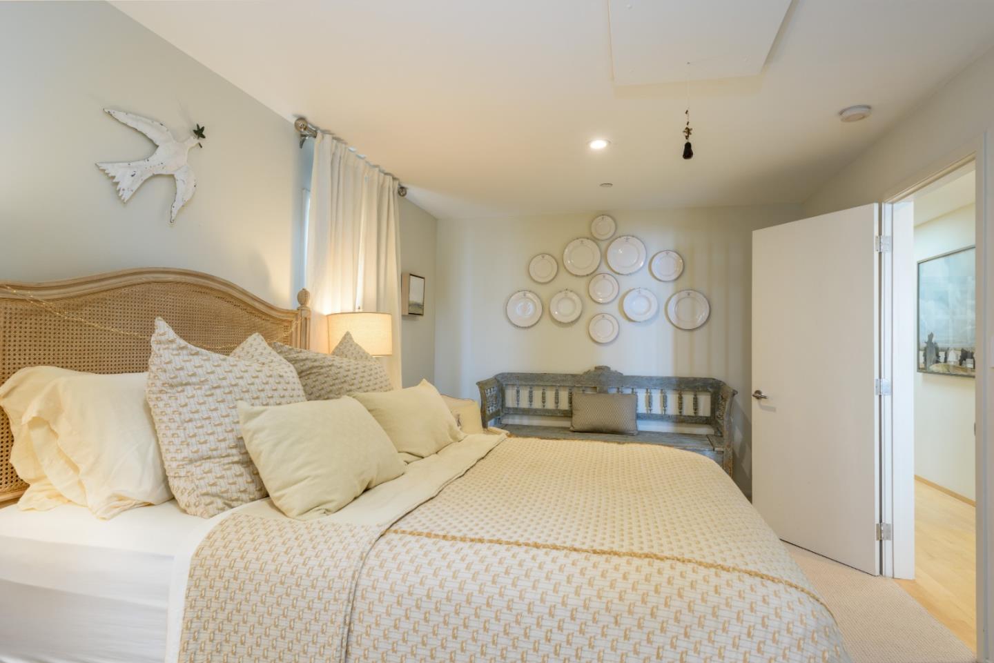 215 Mirada Road Half Moon Bay, CA 94019 - Photo 15 of 47 a bedroom with a bed and a night stand