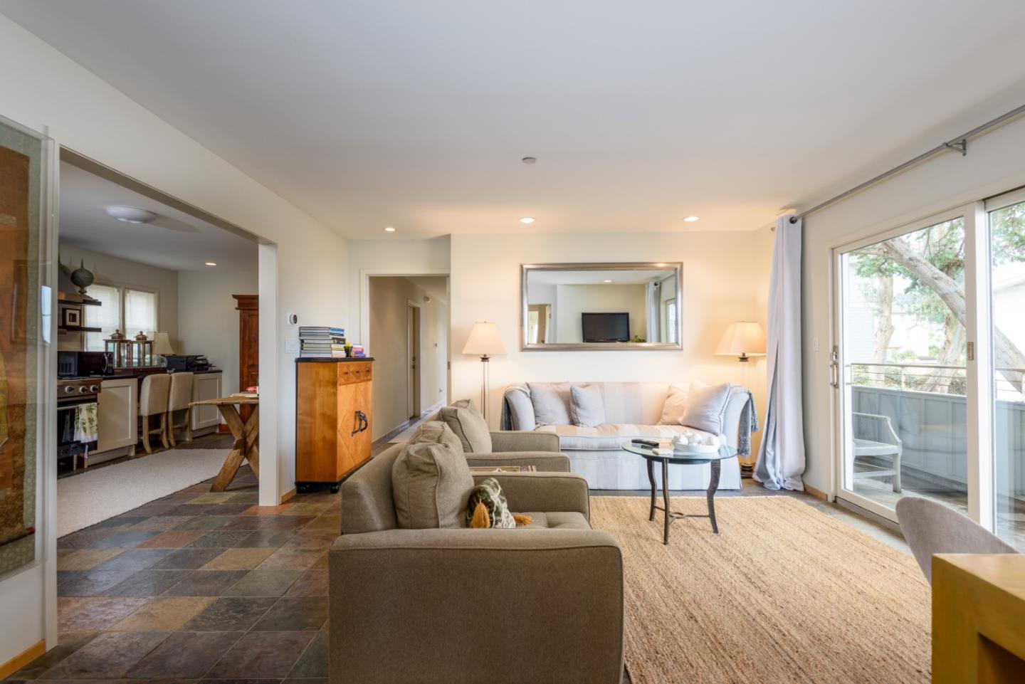215 Mirada Road Half Moon Bay, CA 94019 - Photo 20 of 47 a living room with furniture and a flat screen tv