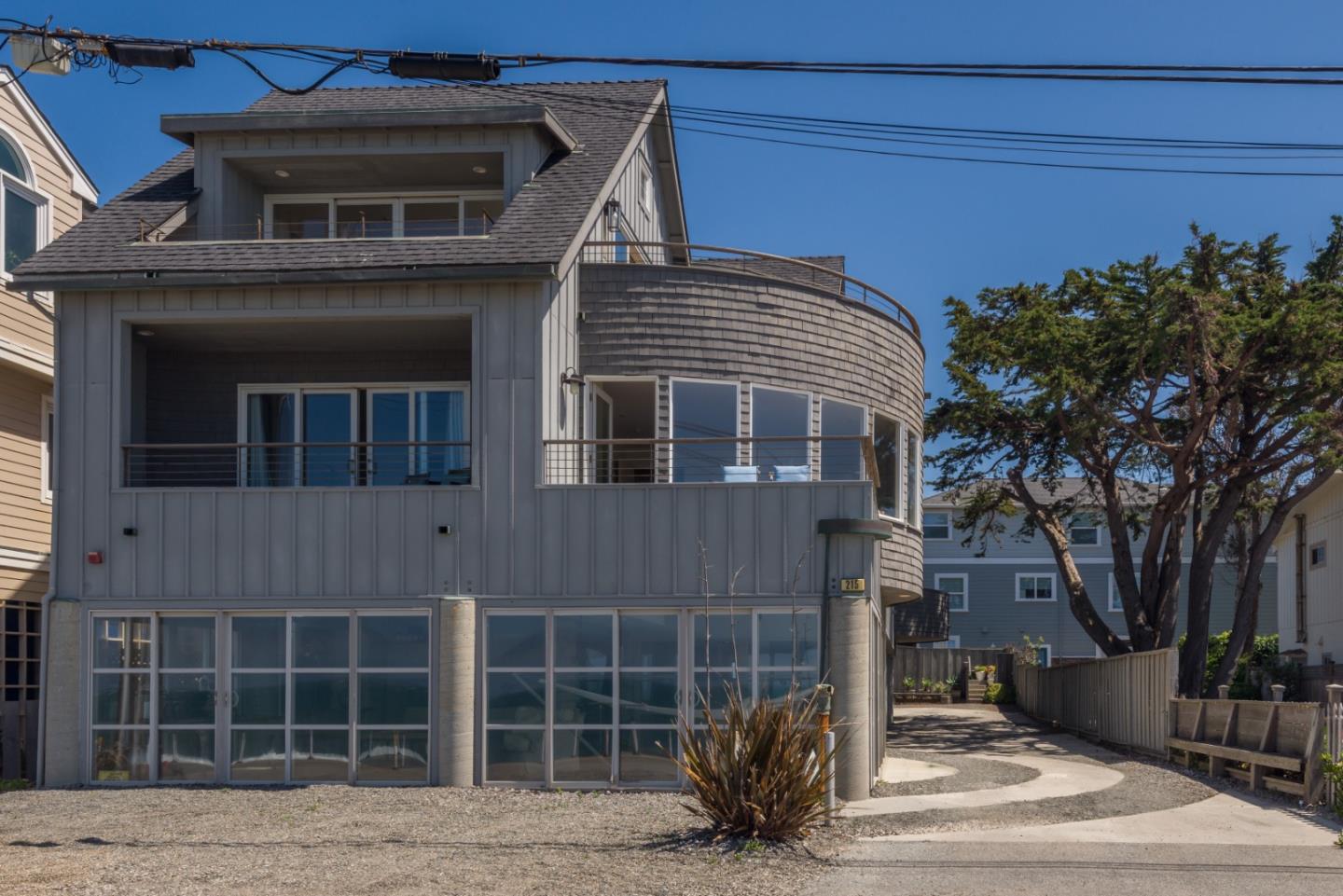 215 Mirada Road Half Moon Bay, CA 94019 - Photo 2 of 47 a front view of a house with a yard