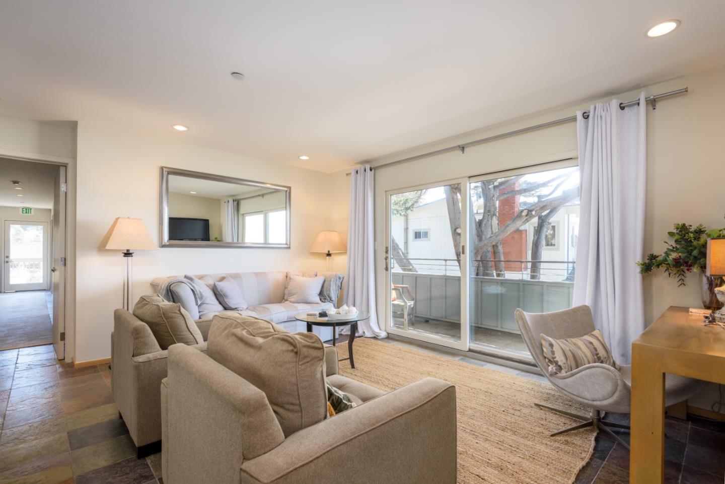 215 Mirada Road Half Moon Bay, CA 94019 - Photo 21 of 47 a living room with furniture and a large window