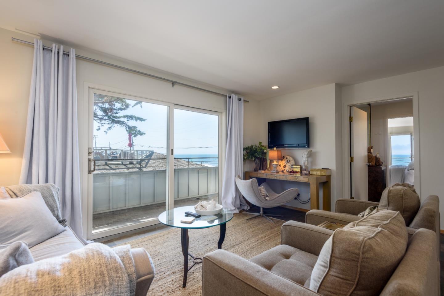 215 Mirada Road Half Moon Bay, CA 94019 - Photo 22 of 47 a living room with furniture and a large window