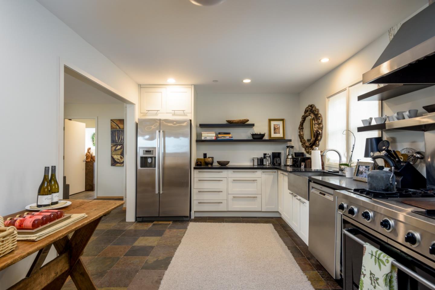 215 Mirada Road Half Moon Bay, CA 94019 - Photo 24 of 47 a kitchen with stainless steel appliances granite countertop a refrigerator and a stove top oven