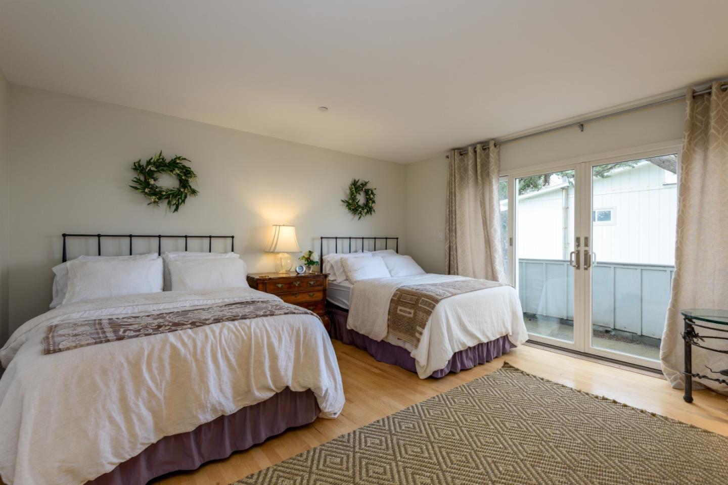 215 Mirada Road Half Moon Bay, CA 94019 - Photo 26 of 47 a bedroom with two beds and large window