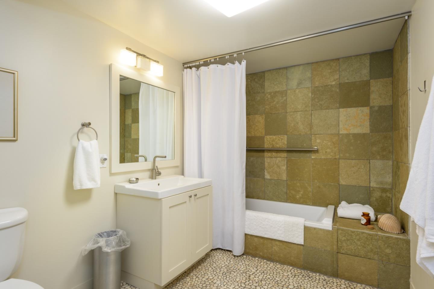 215 Mirada Road Half Moon Bay, CA 94019 - Photo 27 of 47 a bathroom with a sink a toilet and shower