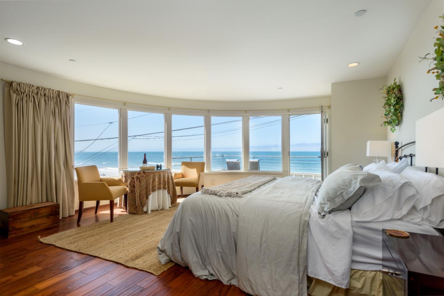 215 Mirada Road Half Moon Bay, CA 94019 - Photo 29 of 47 a bed sitting in a bedroom next to a large window