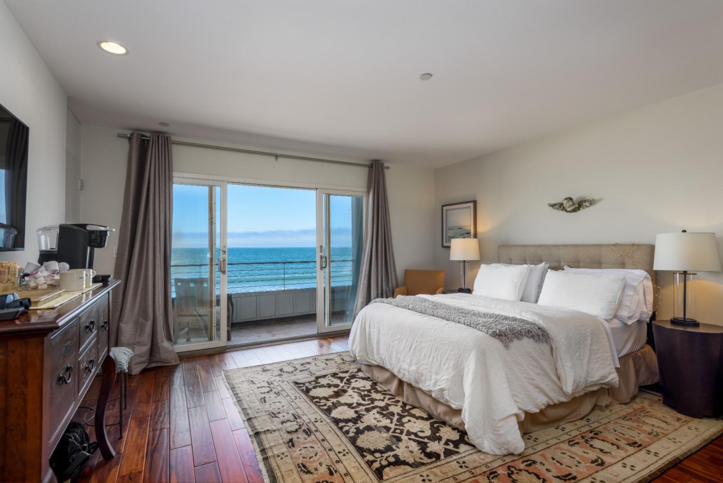 215 Mirada Road Half Moon Bay, CA 94019 - Photo 31 of 47 a bedroom with a bed and a dresser next to a window