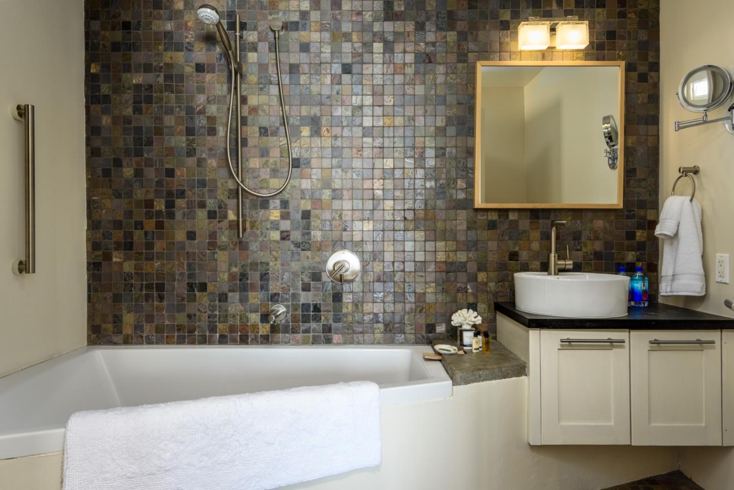 215 Mirada Road Half Moon Bay, CA 94019 - Photo 33 of 47 a bathroom with a granite countertop sink a mirror and bathtub