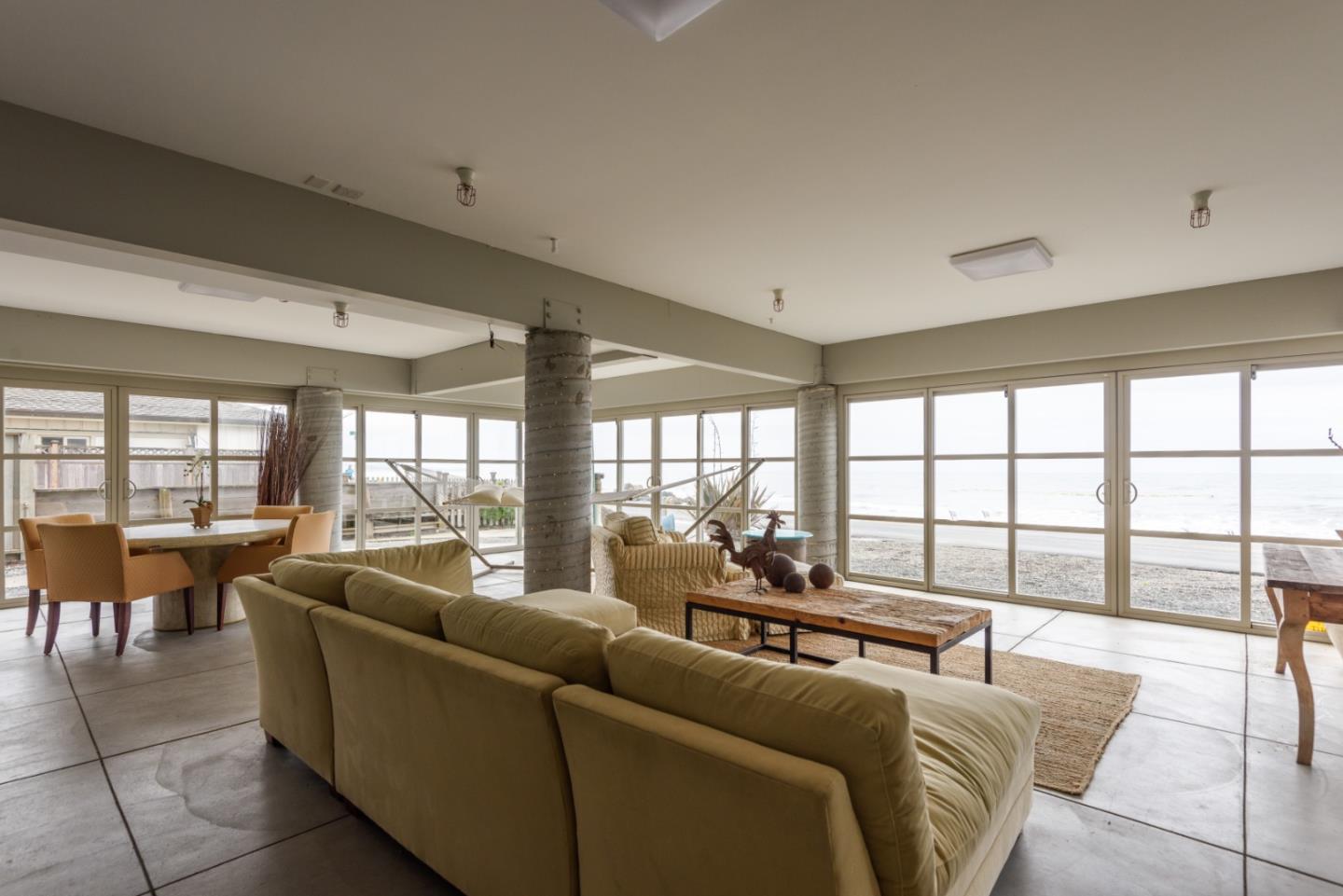 215 Mirada Road Half Moon Bay, CA 94019 - Photo 37 of 47 a living room with furniture and floor to ceiling windows