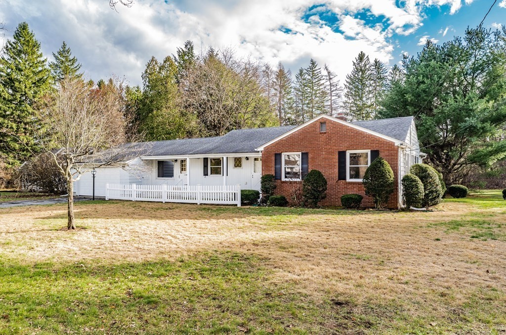 2495 Wilbraham Road Springfield, MA 01129 - Photo 1 of 42 a front view of a house with a yard