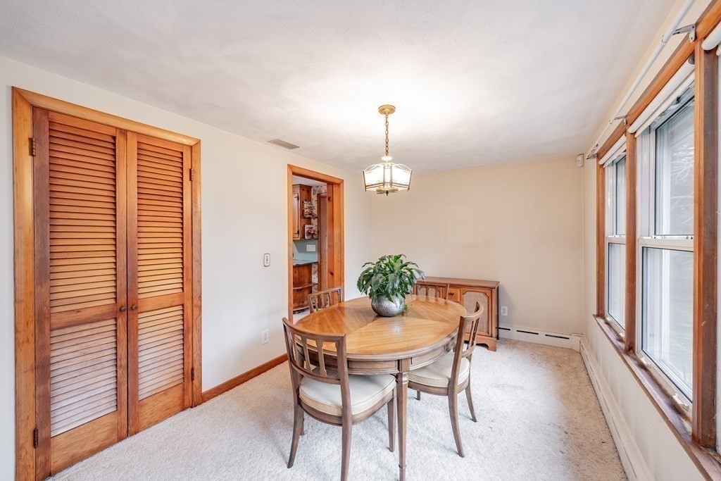 2495 Wilbraham Road Springfield, MA 01129 - Photo 13 of 42 a view of a dining room with furniture window and wooden floor