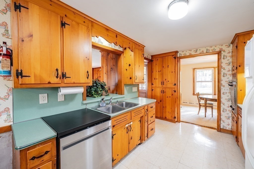 2495 Wilbraham Road Springfield, MA 01129 - Photo 17 of 42 a kitchen with a sink and a stove top oven