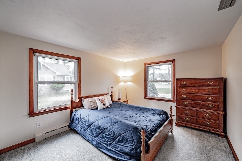 2495 Wilbraham Road Springfield, MA 01129 - Photo 24 of 42 a bedroom with a bed and a window