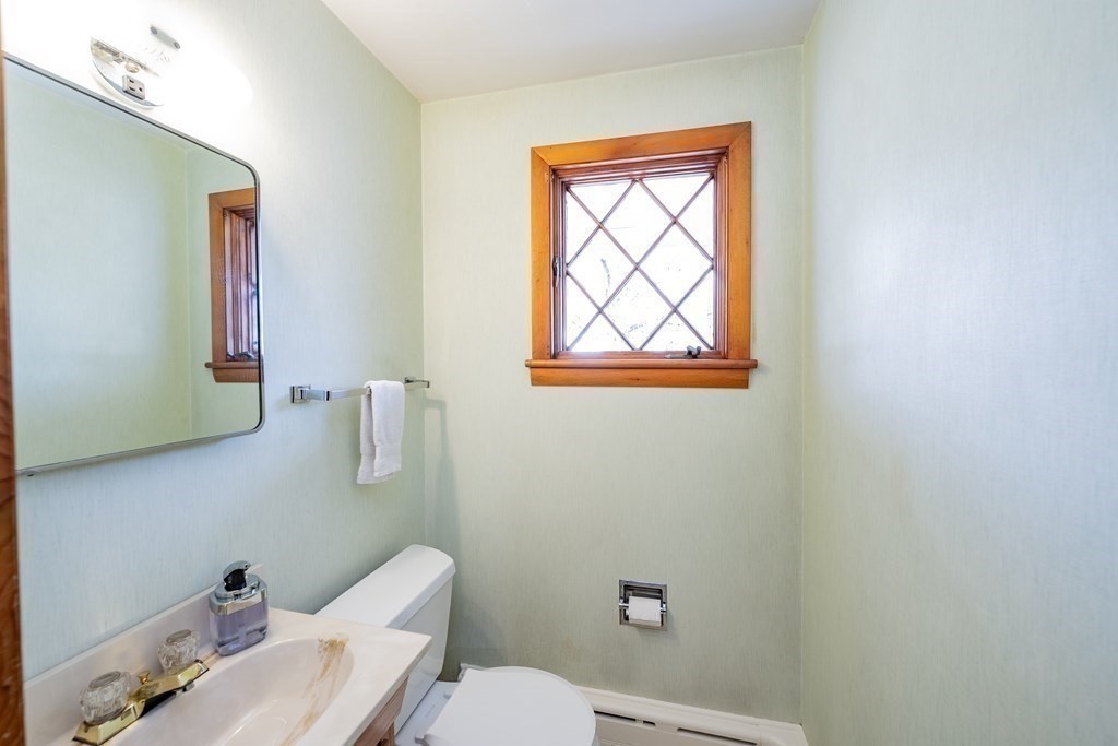 2495 Wilbraham Road Springfield, MA 01129 - Photo 27 of 42 a white toilet sitting next to a bathroom sink