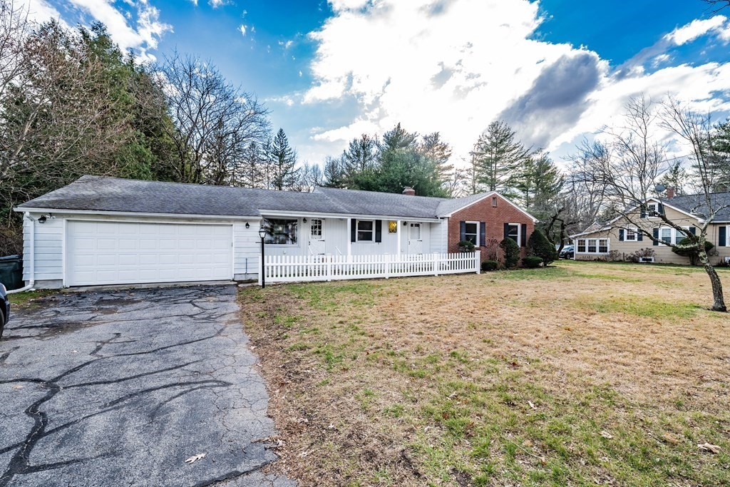 2495 Wilbraham Road Springfield, MA 01129 - Photo 3 of 42 a front view of a house with garden