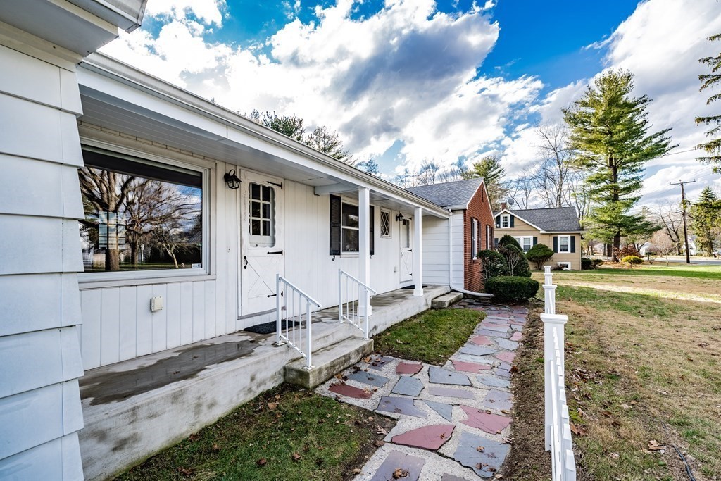 2495 Wilbraham Road Springfield, MA 01129 - Photo 4 of 42 a front view of a house with a yard