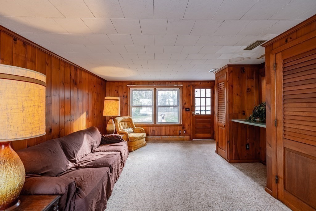 2495 Wilbraham Road Springfield, MA 01129 - Photo 5 of 42 a living room with furniture a large window and stainless steel appliances