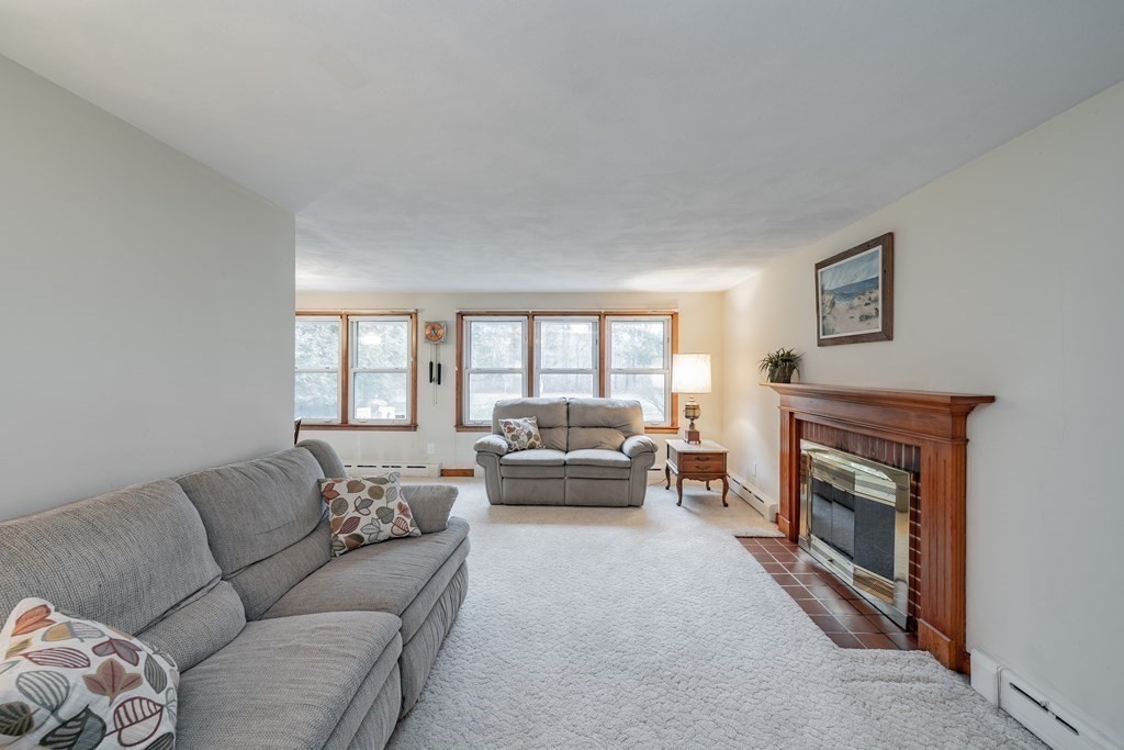2495 Wilbraham Road Springfield, MA 01129 - Photo 9 of 42 a living room with furniture and a fireplace