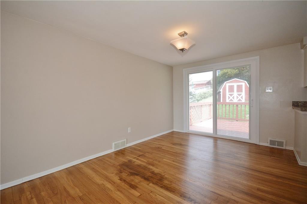 Dining room w/ Pella Slider Leads to Rear Deck