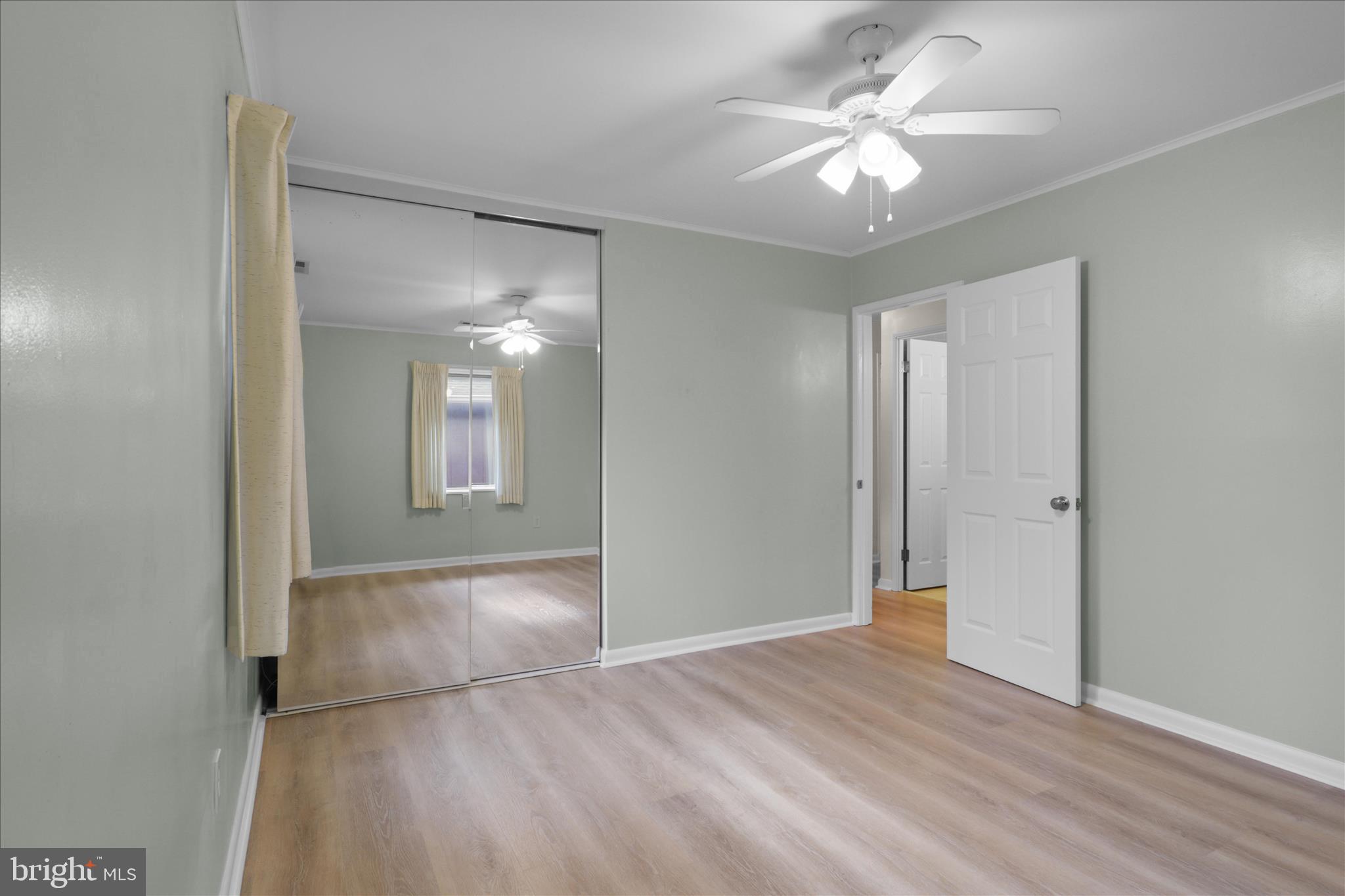 4017 Arcadia Road Alexandria, VA 22312 - Photo 12 of 25 a view of a big room with wooden floor and a ceiling fan