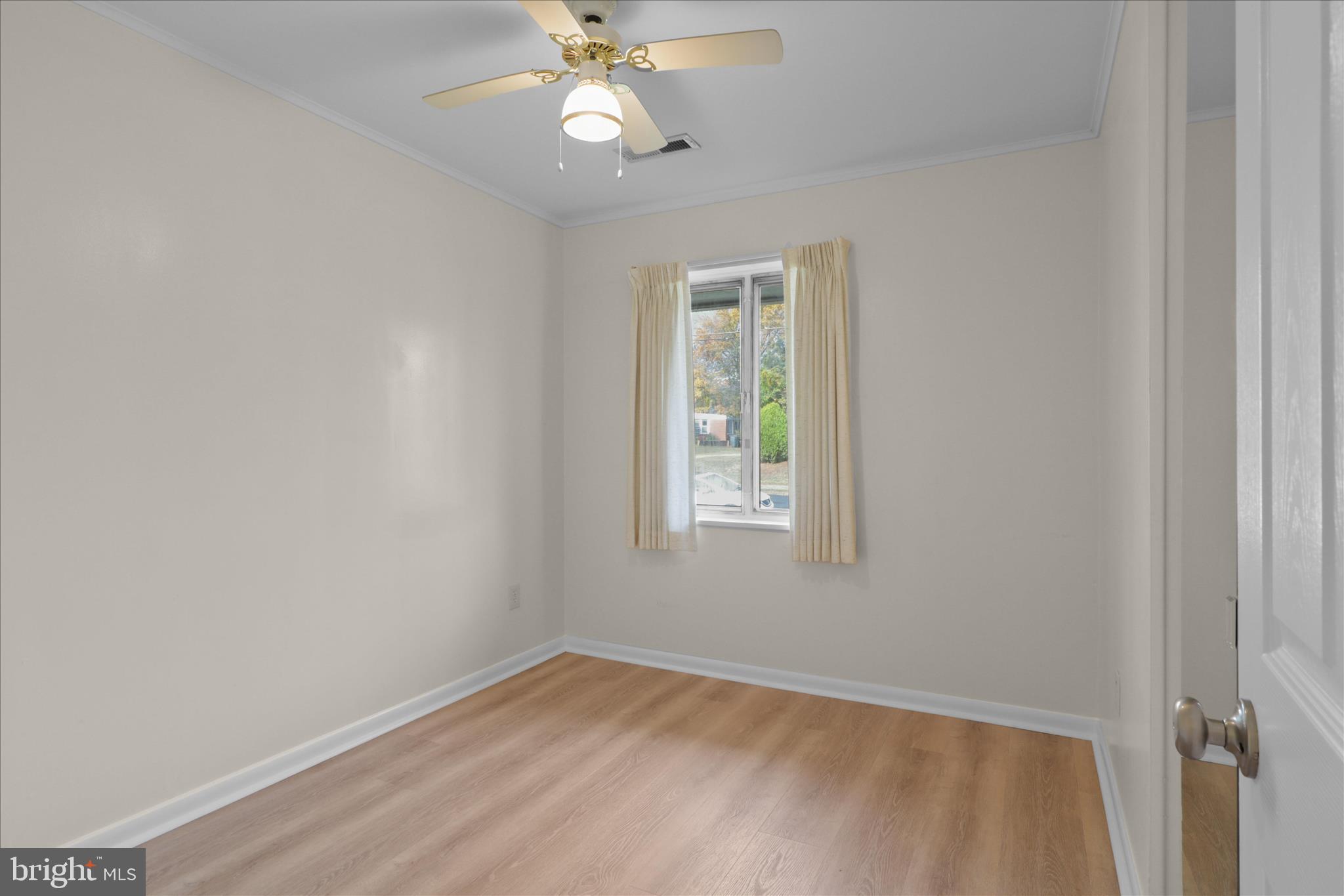 4017 Arcadia Road Alexandria, VA 22312 - Photo 17 of 25 an empty room with a window and chandelier fan