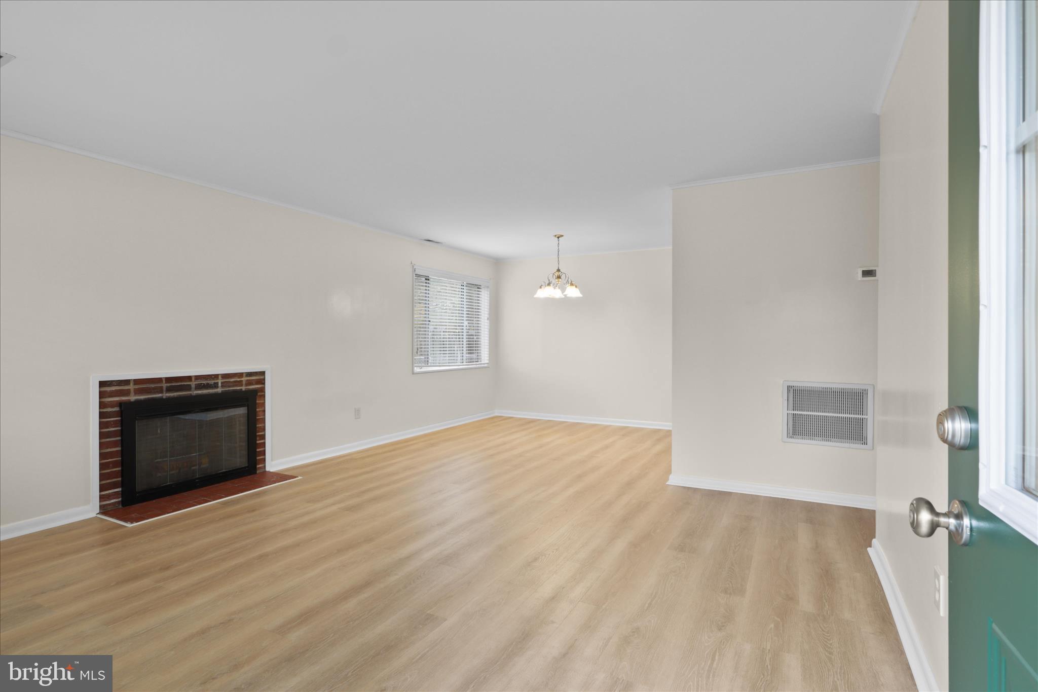 4017 Arcadia Road Alexandria, VA 22312 - Photo 3 of 25 a view of an empty room with wooden floor and a window